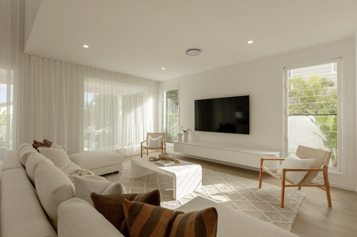 white linen sofa in a spacious contemporary living room, property styling by blink living